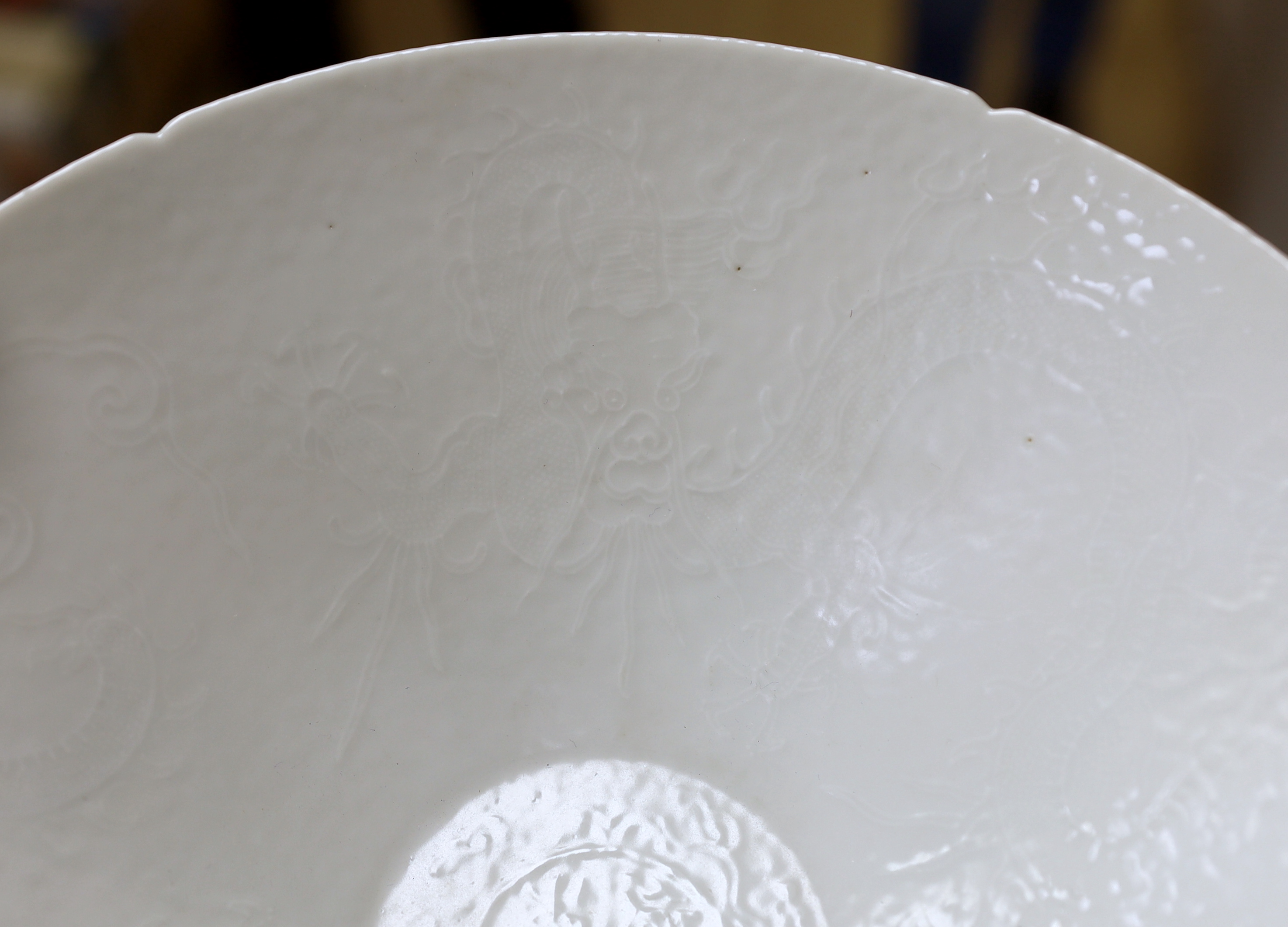 A Chinese white Anhua decorated conical dish, 20cm